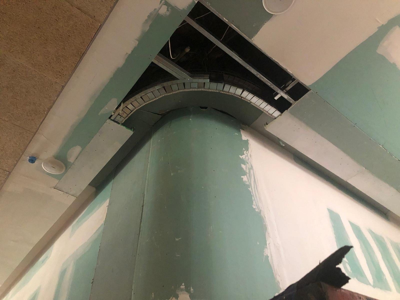 Rounded wall-to-ceiling transition being finished on site
