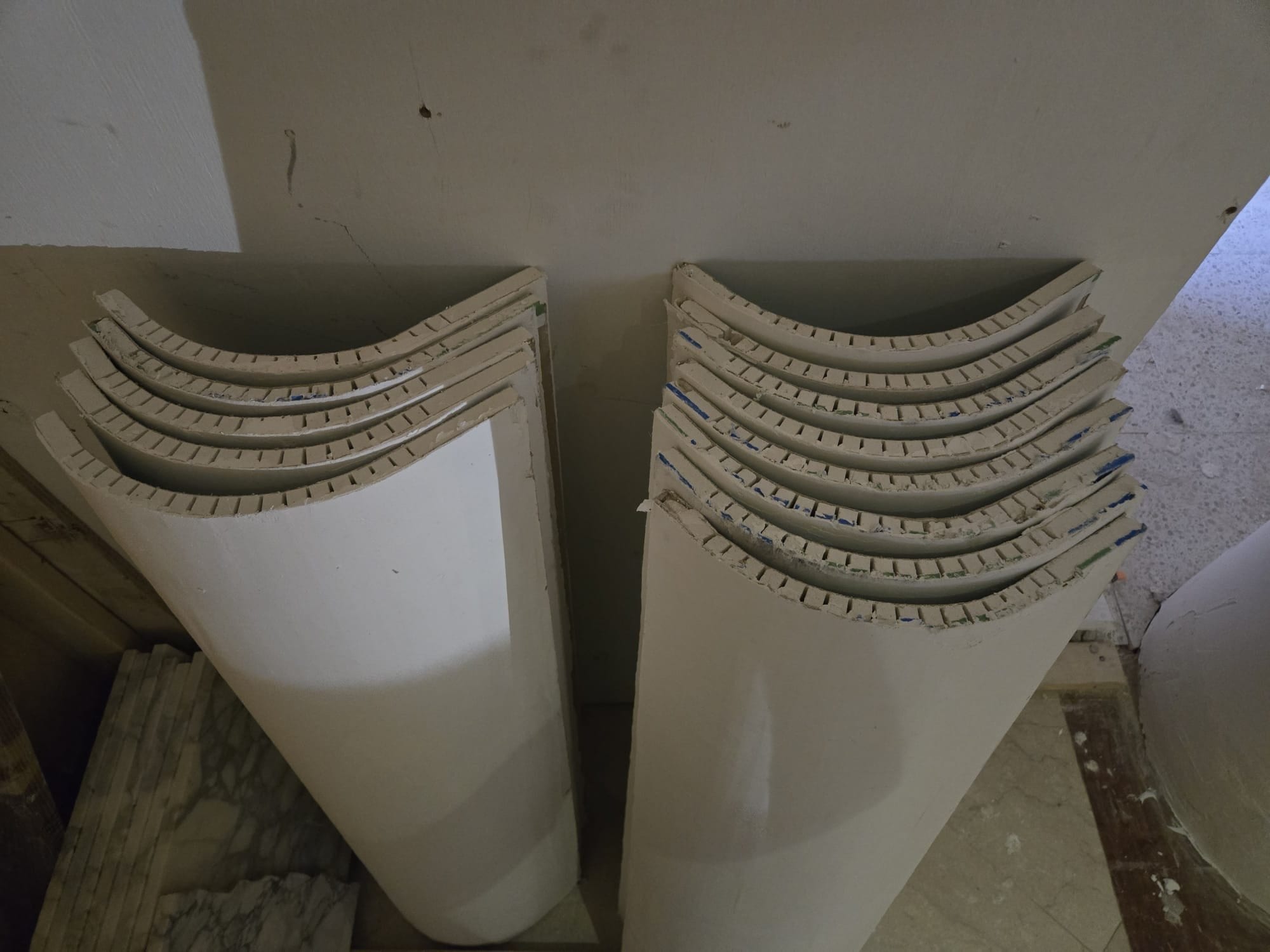 Layered curved composite profiles fabricated in the workshop