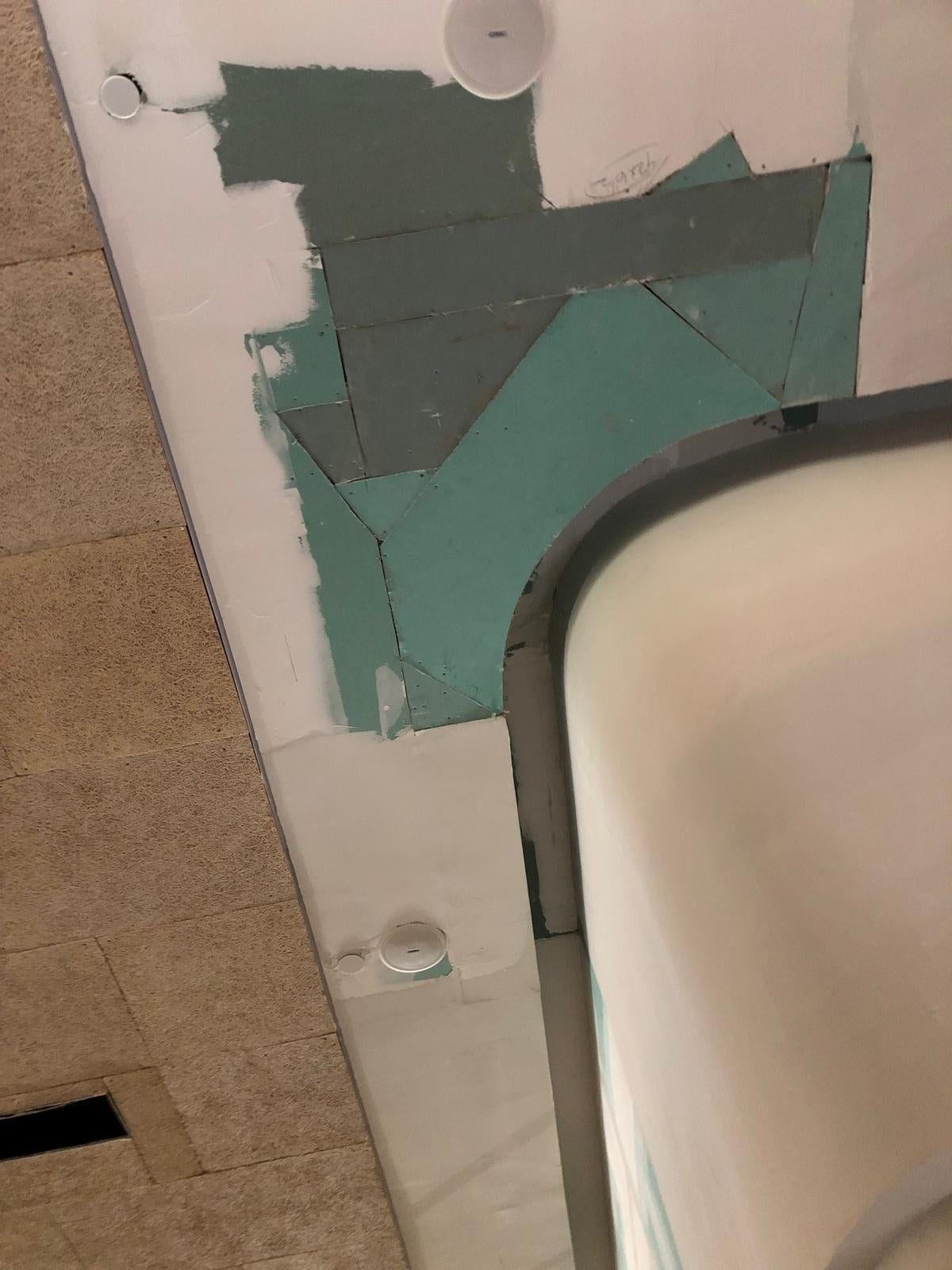 Rounded ceiling edge under construction with exposed framing and joint compound